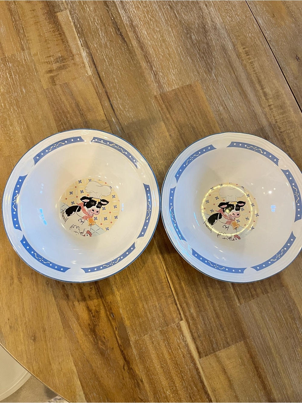 Ceramic Serving Bowl Set with Blue Trim and Cow Chef Motif - Set of 2